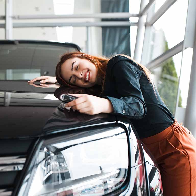 Woman Hugging Car Bonnet