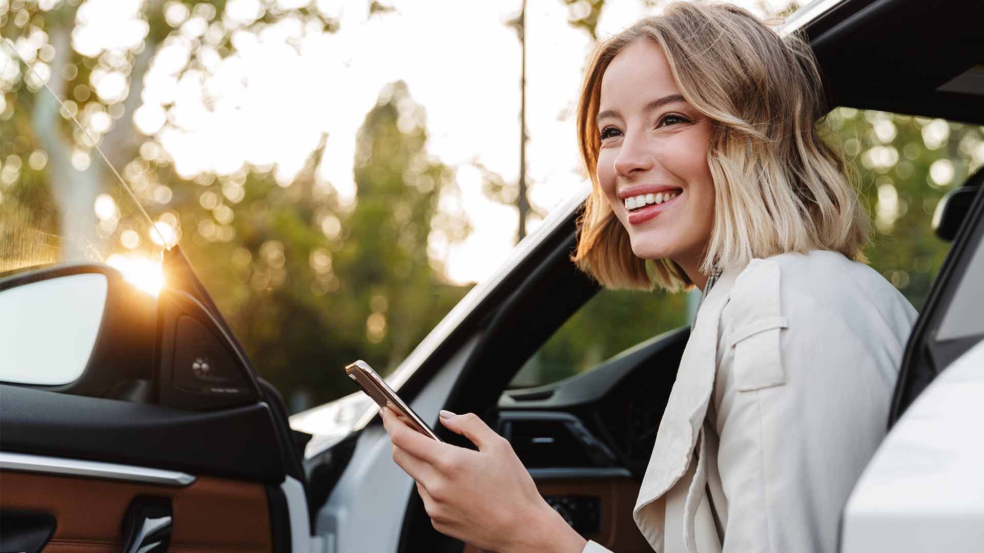 Happy Blonde Womna With Keys